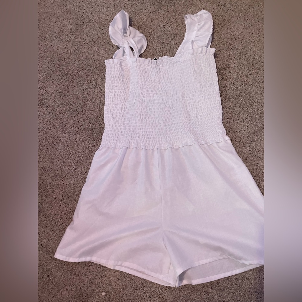 white romper, never been worn. size medium, white.
